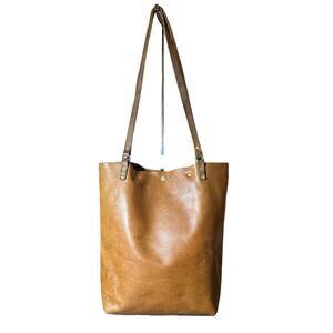 In blue handmade leather tote brown button closure